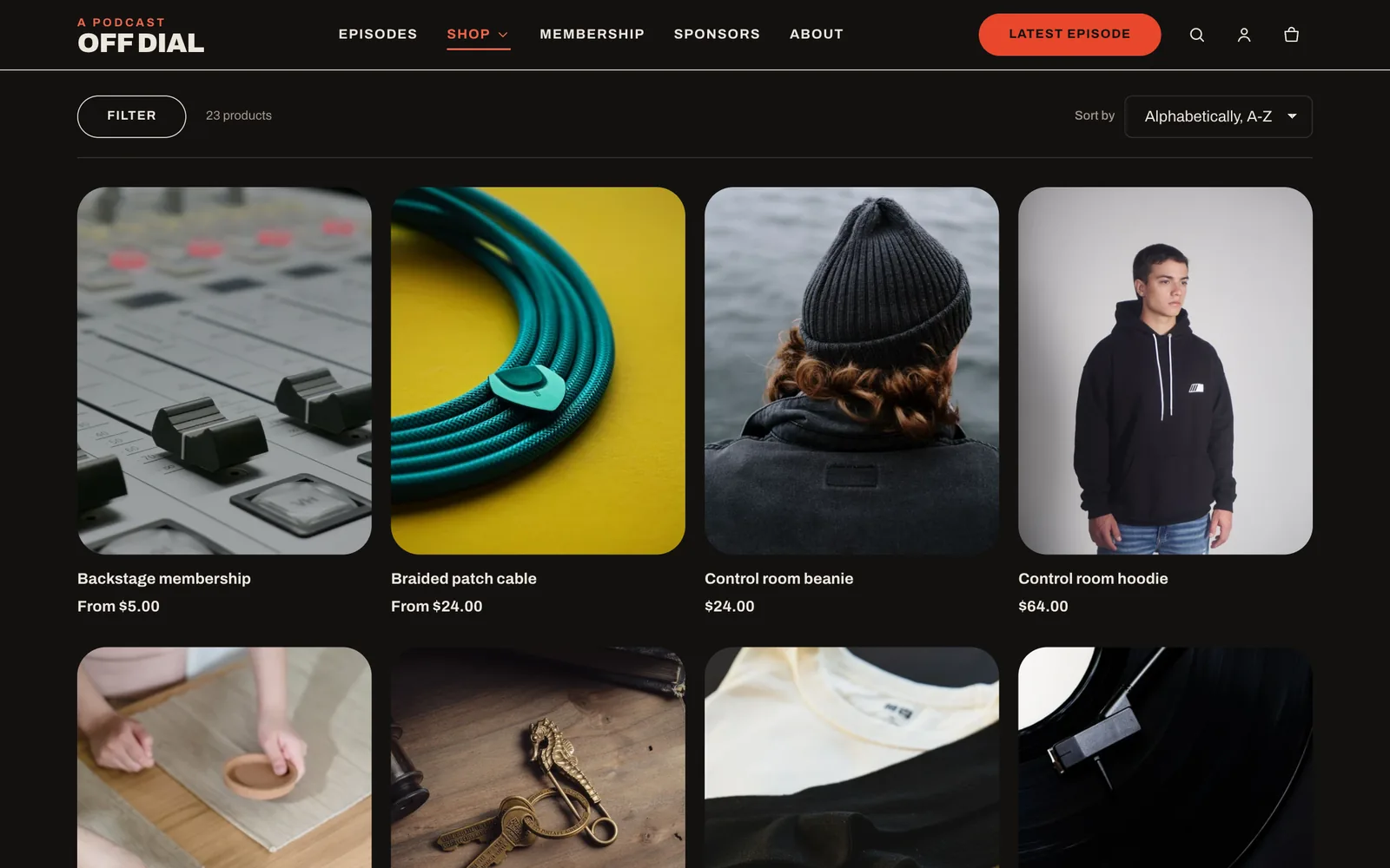 Collection page with a four-column product grid and a filter button.